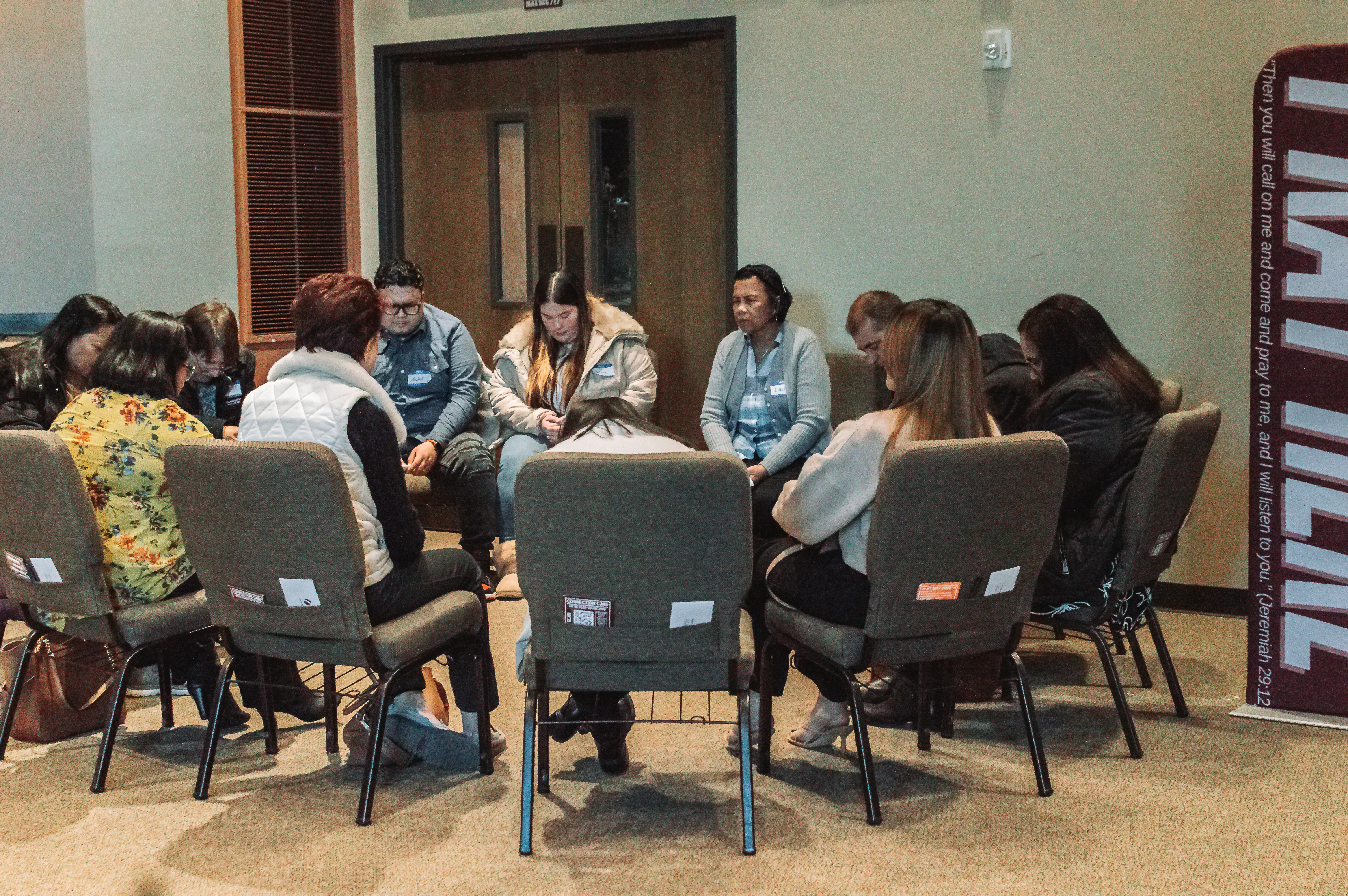 People in home small group discussion